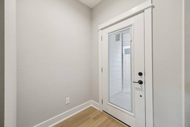 812 Thornton St Unit D, Houston, TX 77018 - doorway to outside featuring light wood-style floors and baseboards