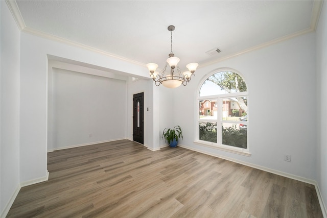 2111 Scenic Hollow Ct, Katy, TX 77450 - unfurnished room with a chandelier, light wood finished floors, and ornamental molding