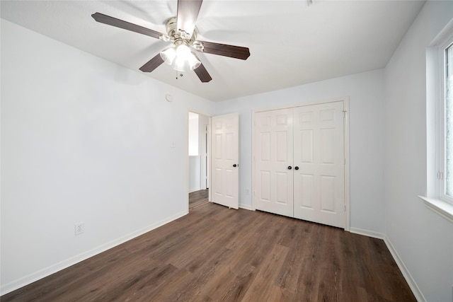 2111 Scenic Hollow Ct, Katy, TX 77450 - unfurnished bedroom featuring dark wood finished floors, a closet, and ceiling fan
