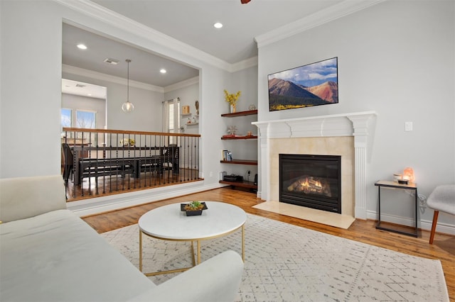 2841 Sherwin St, Houston, TX 77007 - living area with wood finished floors, a tile fireplace, ornamental molding, and recessed lighting