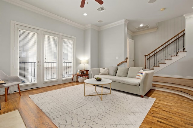 2841 Sherwin St, Houston, TX 77007 - living room with light wood-style flooring, a ceiling fan, ornamental molding, stairway, and recessed lighting