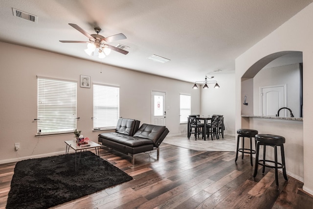 901 Jefferson Ave, Cleveland, TX 77327 - living area featuring ceiling fan, hardwood / wood-style flooring, and arched walkways
