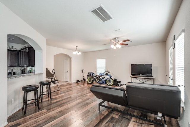 901 Jefferson Ave, Cleveland, TX 77327 - living room featuring wood finished floors, arched walkways, and ceiling fan