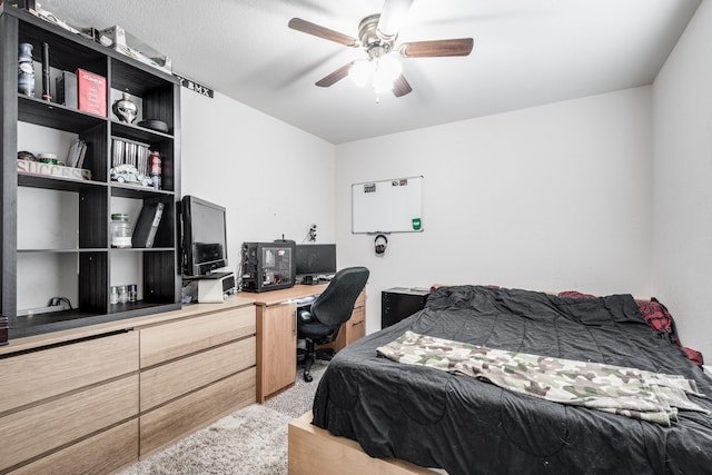 901 Jefferson Ave, Cleveland, TX 77327 - bedroom with an office area, ceiling fan, and light colored carpet