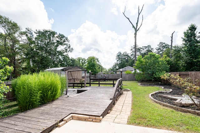 901 Jefferson Ave, Cleveland, TX 77327 - wooden terrace featuring a fenced backyard