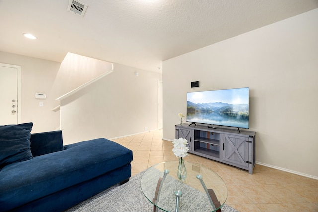 814 Eagles Glide Dr, Houston, TX 77090 - living area featuring tile patterned flooring, recessed lighting, and stairway