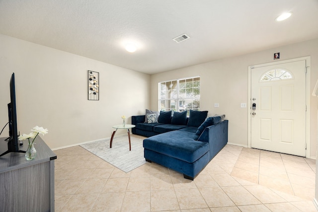 814 Eagles Glide Dr, Houston, TX 77090 - living area featuring light tile patterned flooring and baseboards