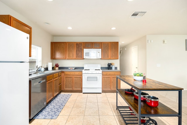 814 Eagles Glide Dr, Houston, TX 77090 - kitchen featuring white appliances, recessed lighting, and light tile patterned floors