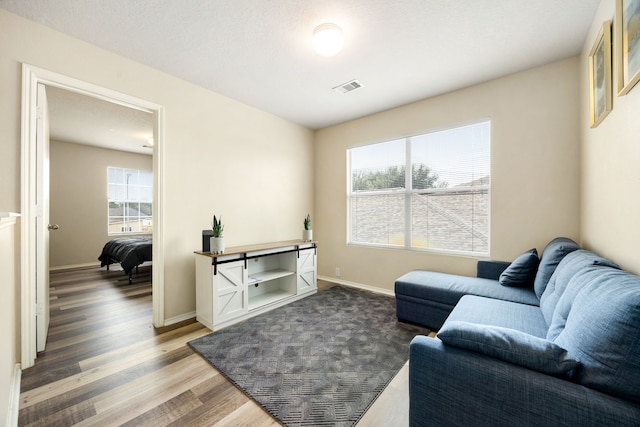 814 Eagles Glide Dr, Houston, TX 77090 - living area with wood finished floors and baseboards