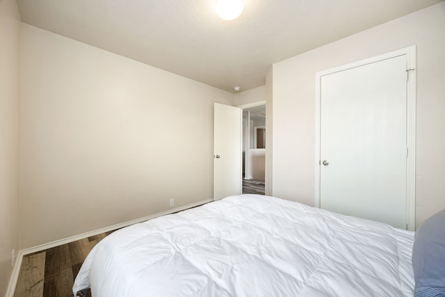 814 Eagles Glide Dr, Houston, TX 77090 - bedroom featuring wood finished floors and baseboards