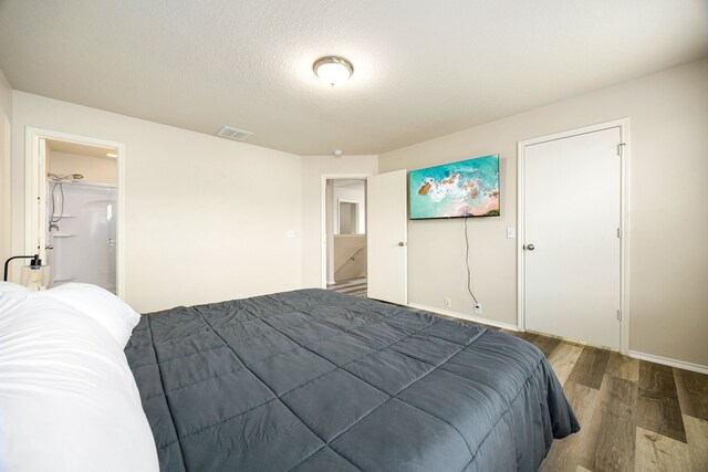 814 Eagles Glide Dr, Houston, TX 77090 - bedroom featuring wood finished floors and baseboards