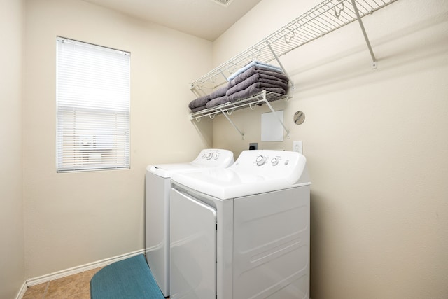 814 Eagles Glide Dr, Houston, TX 77090 - washroom with separate washer and dryer and baseboards