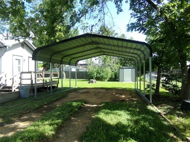 505 S Saint Andrews St, Weimar, TX 78962 - view of vehicle parking featuring a storage shed and a carport