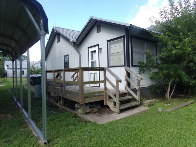 505 S Saint Andrews St, Weimar, TX 78962 - rear view of house with a metal roof, a yard, and a wooden deck