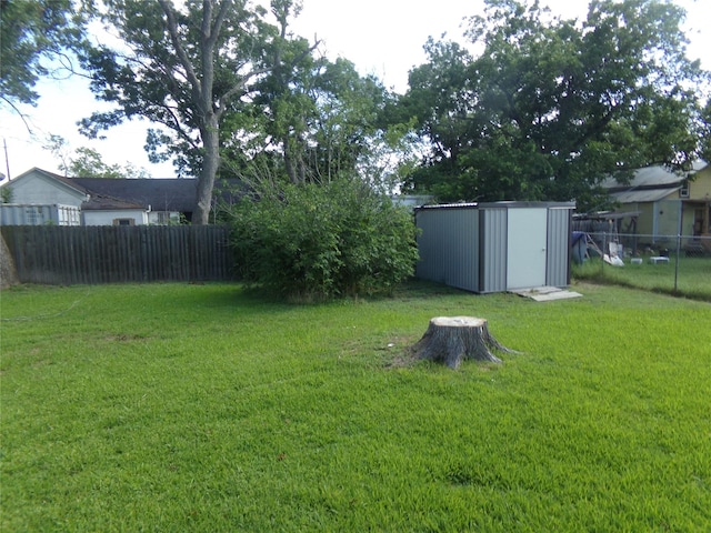 505 S Saint Andrews St, Weimar, TX 78962 - fenced backyard featuring a storage unit
