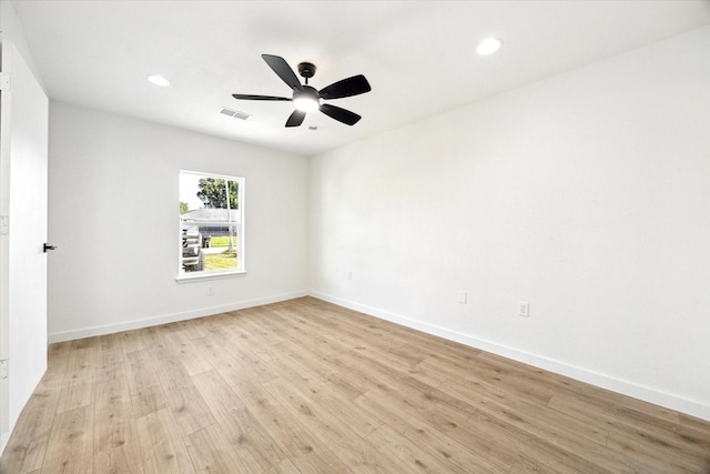 5859 Belmark St, Houston, TX 77033 - empty room with light wood-style floors, ceiling fan, and recessed lighting