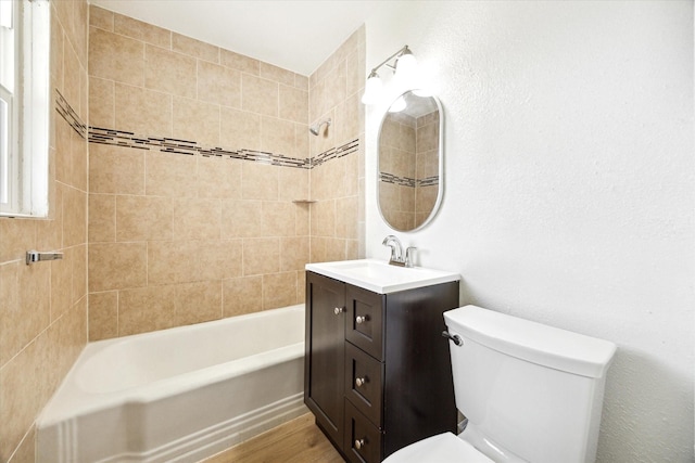 5859 Belmark St, Houston, TX 77033 - bathroom with vanity, washtub / shower combination, and wood finished floors