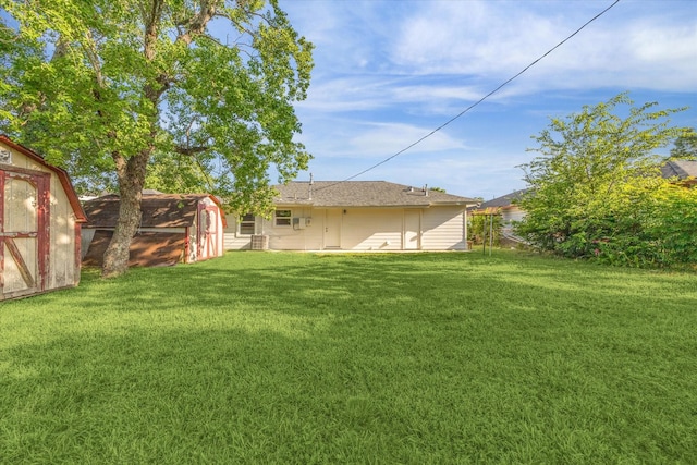 5859 Belmark St, Houston, TX 77033 - view of green lawn with a storage unit