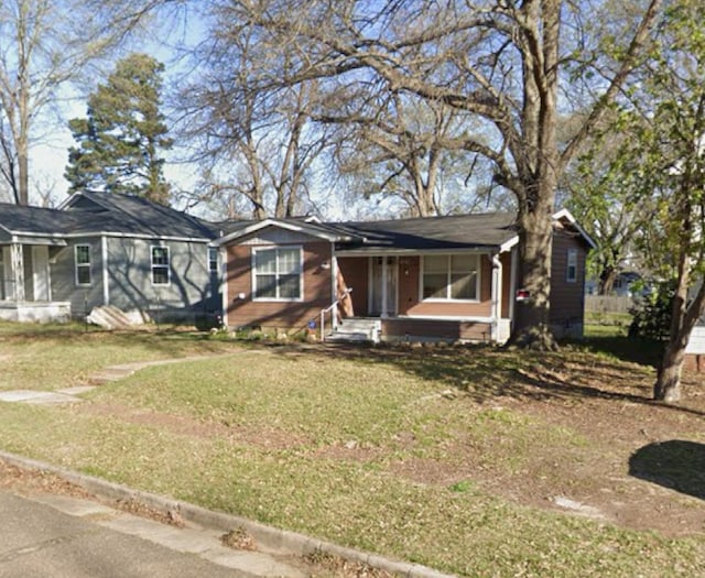 1216 W 6th St, Texarkana, TX 75501 - single story home featuring a front lawn and covered porch