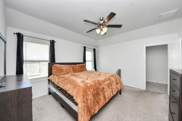 1404 Woods Lake Ct, Houston, TX 77047 - bedroom with light carpet and ceiling fan