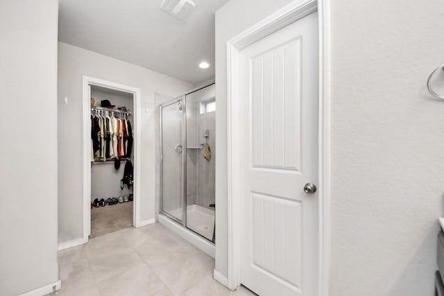1404 Woods Lake Ct, Houston, TX 77047 - full bath with a shower stall, a spacious closet, tile patterned floors, and recessed lighting