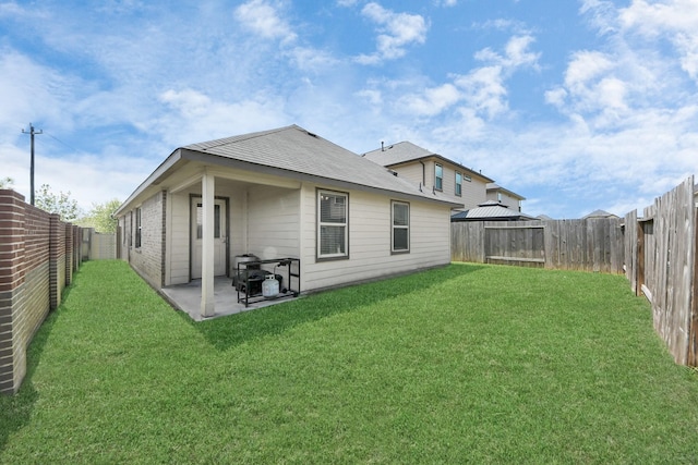 1404 Woods Lake Ct, Houston, TX 77047 - back of house with a fenced backyard and a patio area