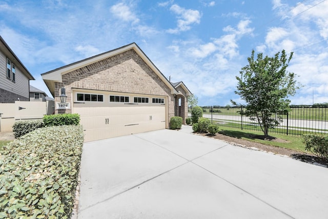 1404 Woods Lake Ct, Houston, TX 77047 - view of front of house with brick siding and driveway