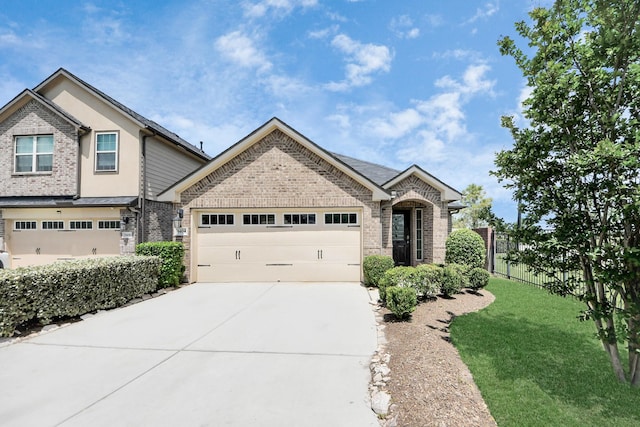 1404 Woods Lake Ct, Houston, TX 77047 - view of front of home featuring brick siding, driveway, and an attached garage