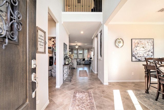 31144 Aspen Gate Trl, Spring, TX 77386 - foyer featuring crown molding, a ceiling fan, washer / clothes dryer, and recessed lighting