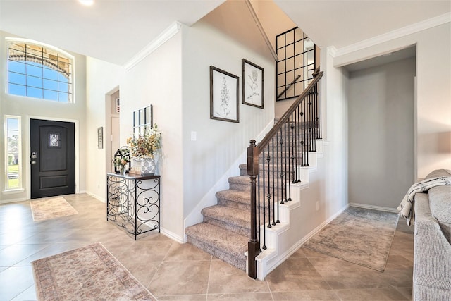 31144 Aspen Gate Trl, Spring, TX 77386 - foyer featuring a high ceiling, stairway, ornamental molding, and tile patterned flooring