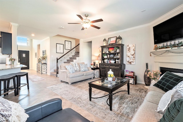 31144 Aspen Gate Trl, Spring, TX 77386 - living area featuring crown molding, stairway, a fireplace, and ceiling fan
