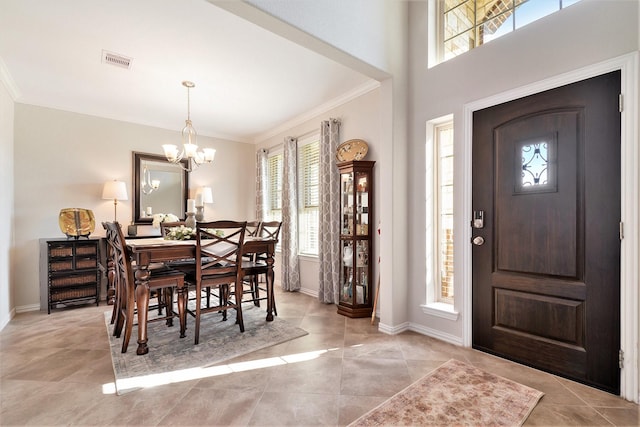 31144 Aspen Gate Trl, Spring, TX 77386 - entryway featuring crown molding, a chandelier, plenty of natural light, and light tile patterned floors