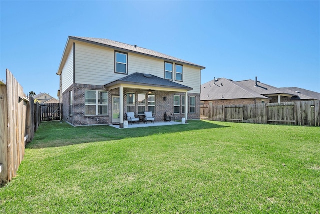 31144 Aspen Gate Trl, Spring, TX 77386 - back of property with a patio, brick siding, a fenced backyard, and a ceiling fan