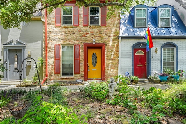 5237 Arboles Dr Unit C, Houston, TX 77035 - townhome / multi-family property featuring brick siding, a standing seam roof, and a metal roof