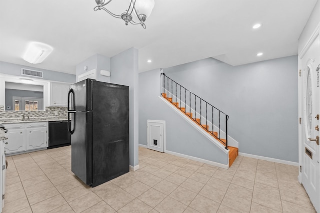 5237 Arboles Dr Unit C, Houston, TX 77035 - kitchen with black appliances, light countertops, tasteful backsplash, recessed lighting, and light tile patterned floors