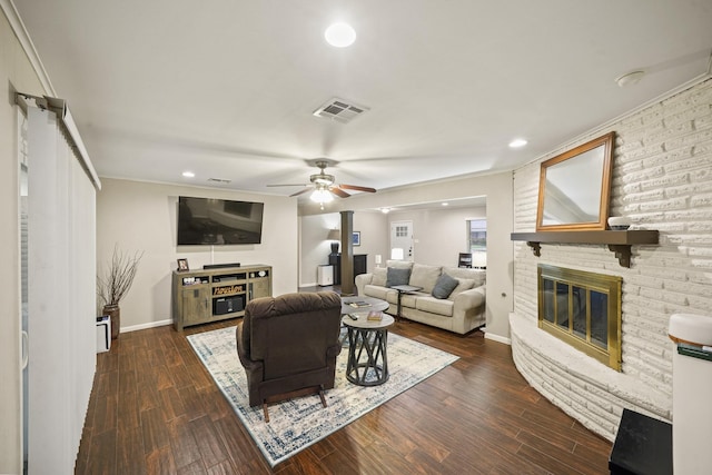 5810 Wigton Dr, Houston, TX 77096 - living area with a fireplace, a ceiling fan, dark wood-style flooring, recessed lighting, and crown molding