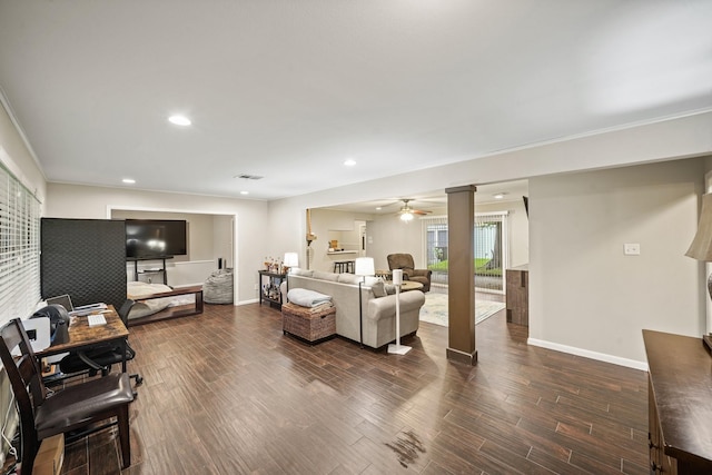 5810 Wigton Dr, Houston, TX 77096 - living room featuring a ceiling fan, dark wood finished floors, recessed lighting, and ornate columns