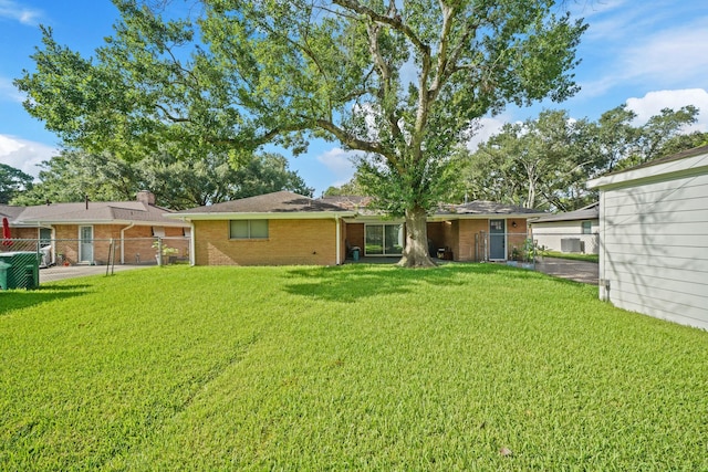 5810 Wigton Dr, Houston, TX 77096 - back of house with brick siding and a gate