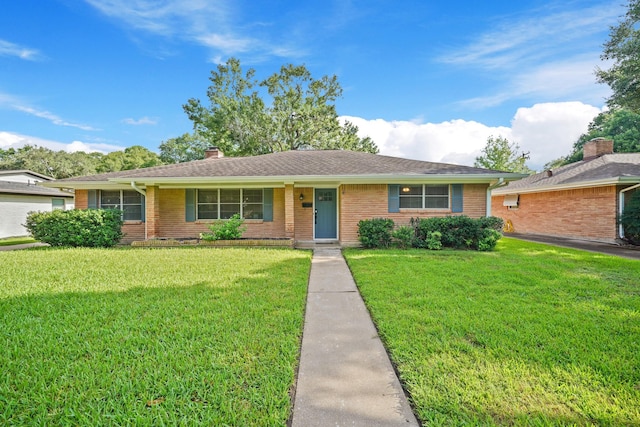 5810 Wigton Dr, Houston, TX 77096 - single story home featuring brick siding, a front lawn, and a chimney