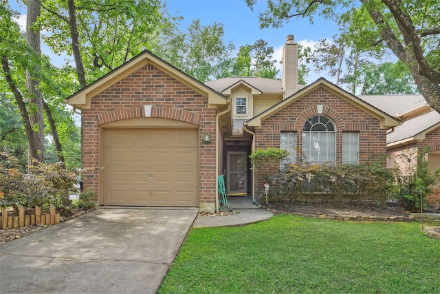 2920 Elm Grove Ct, Kingwood, TX 77339 - view of front facade with brick siding, driveway, and a front lawn