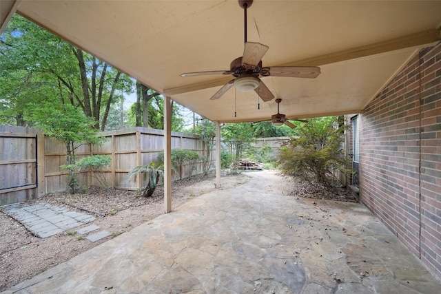 2920 Elm Grove Ct, Kingwood, TX 77339 - fenced backyard featuring a ceiling fan and a patio