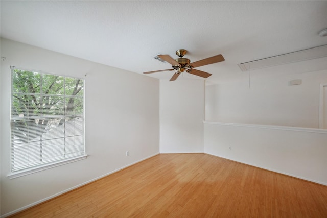 2920 Elm Grove Ct, Kingwood, TX 77339 - empty room featuring attic access, wood finished floors, and a ceiling fan