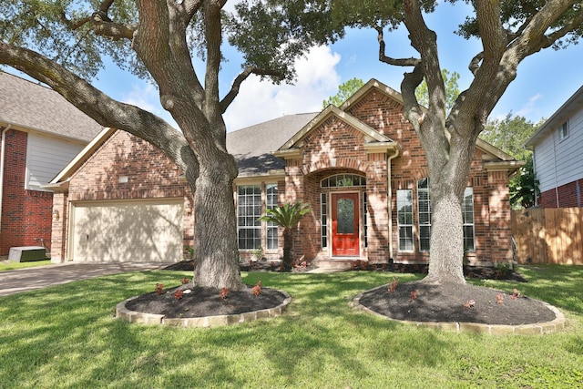 9111 Sutter Ranch Dr, Houston, TX 77064 - traditional home with brick siding, a garage, and driveway