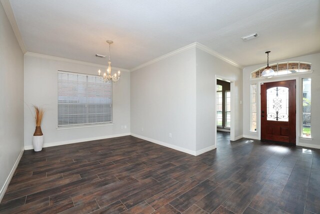 9111 Sutter Ranch Dr, Houston, TX 77064 - entrance foyer featuring a chandelier, dark wood-style flooring, and ornamental molding