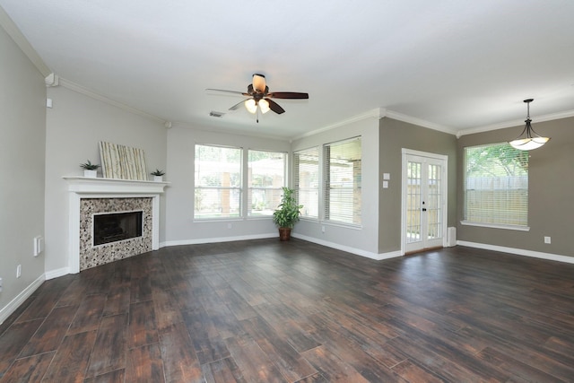 9111 Sutter Ranch Dr, Houston, TX 77064 - unfurnished living room featuring ceiling fan, a tile fireplace, dark wood finished floors, crown molding, and healthy amount of natural light
