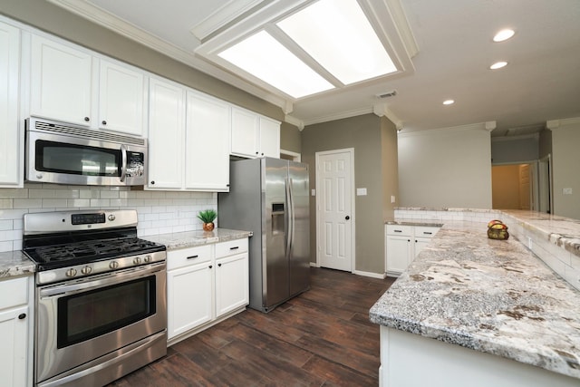 9111 Sutter Ranch Dr, Houston, TX 77064 - kitchen featuring appliances with stainless steel finishes, ornamental molding, recessed lighting, dark wood-style floors, and backsplash