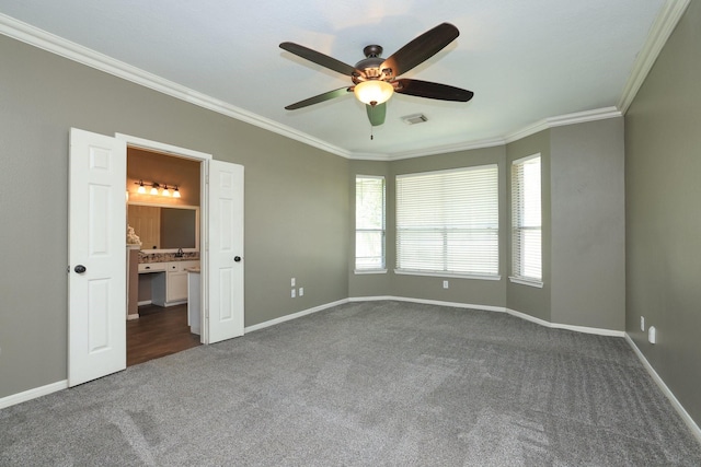 9111 Sutter Ranch Dr, Houston, TX 77064 - unfurnished bedroom featuring dark carpet, crown molding, ceiling fan, and connected bathroom
