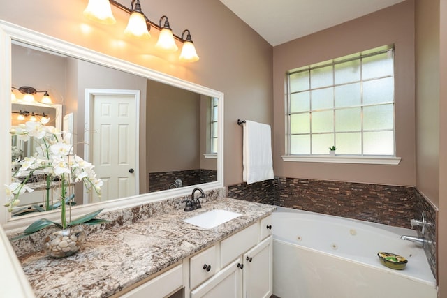 9111 Sutter Ranch Dr, Houston, TX 77064 - bathroom with a tub with jets and vanity