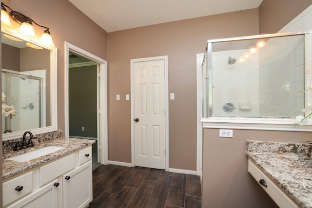 9111 Sutter Ranch Dr, Houston, TX 77064 - full bath with vanity, a stall shower, and wood finished floors