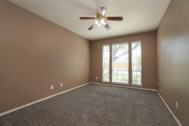 9111 Sutter Ranch Dr, Houston, TX 77064 - spare room with dark carpet and a ceiling fan